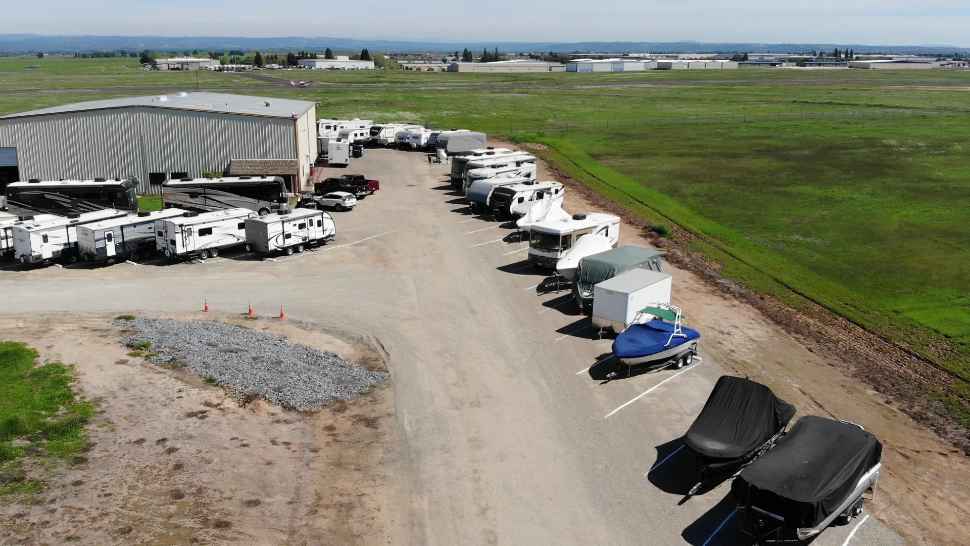 Affordable RV and Boat Storage building with RVs parked alongside it in Lincoln